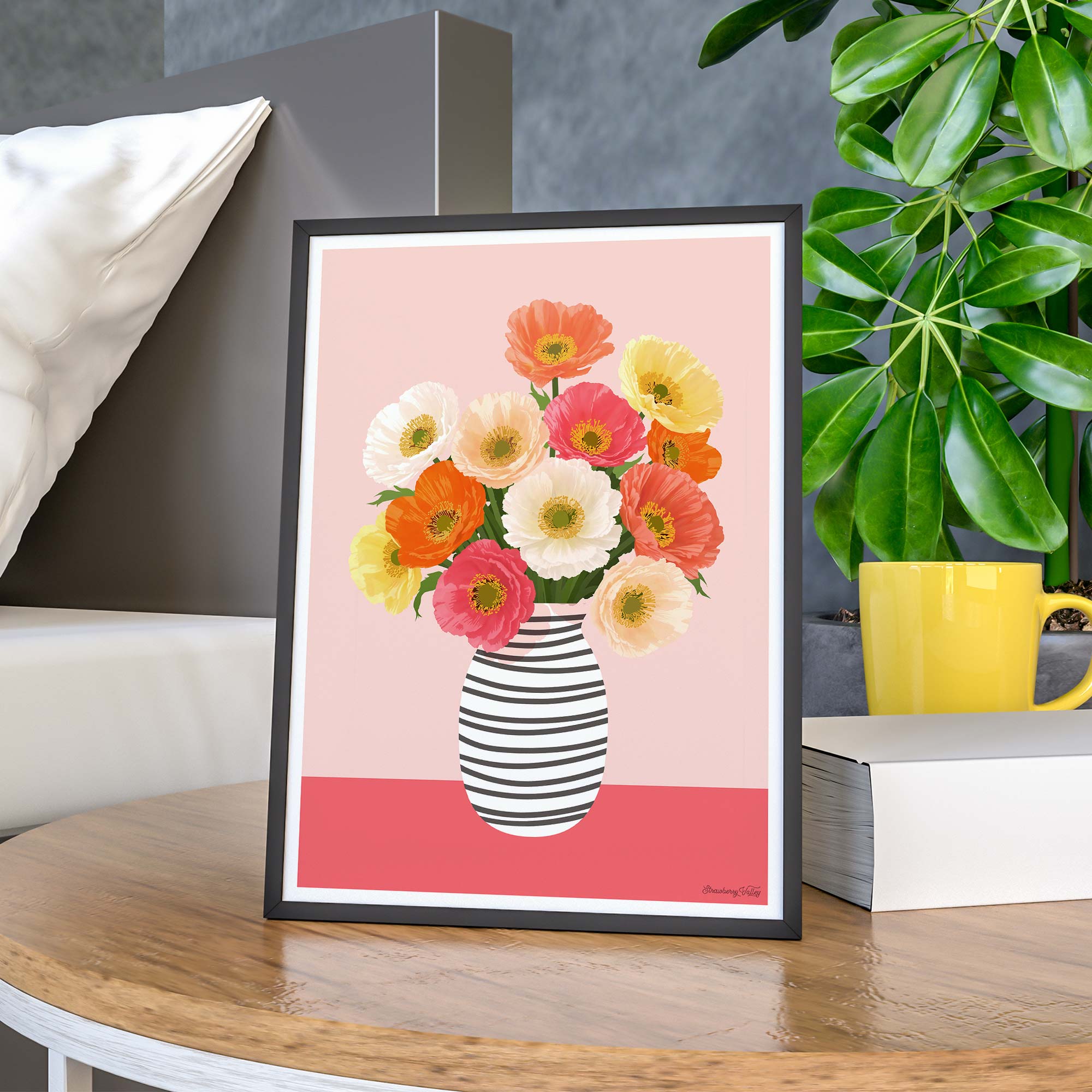 Framed artwork of a colorful floral arrangement in a striped vase on a table.