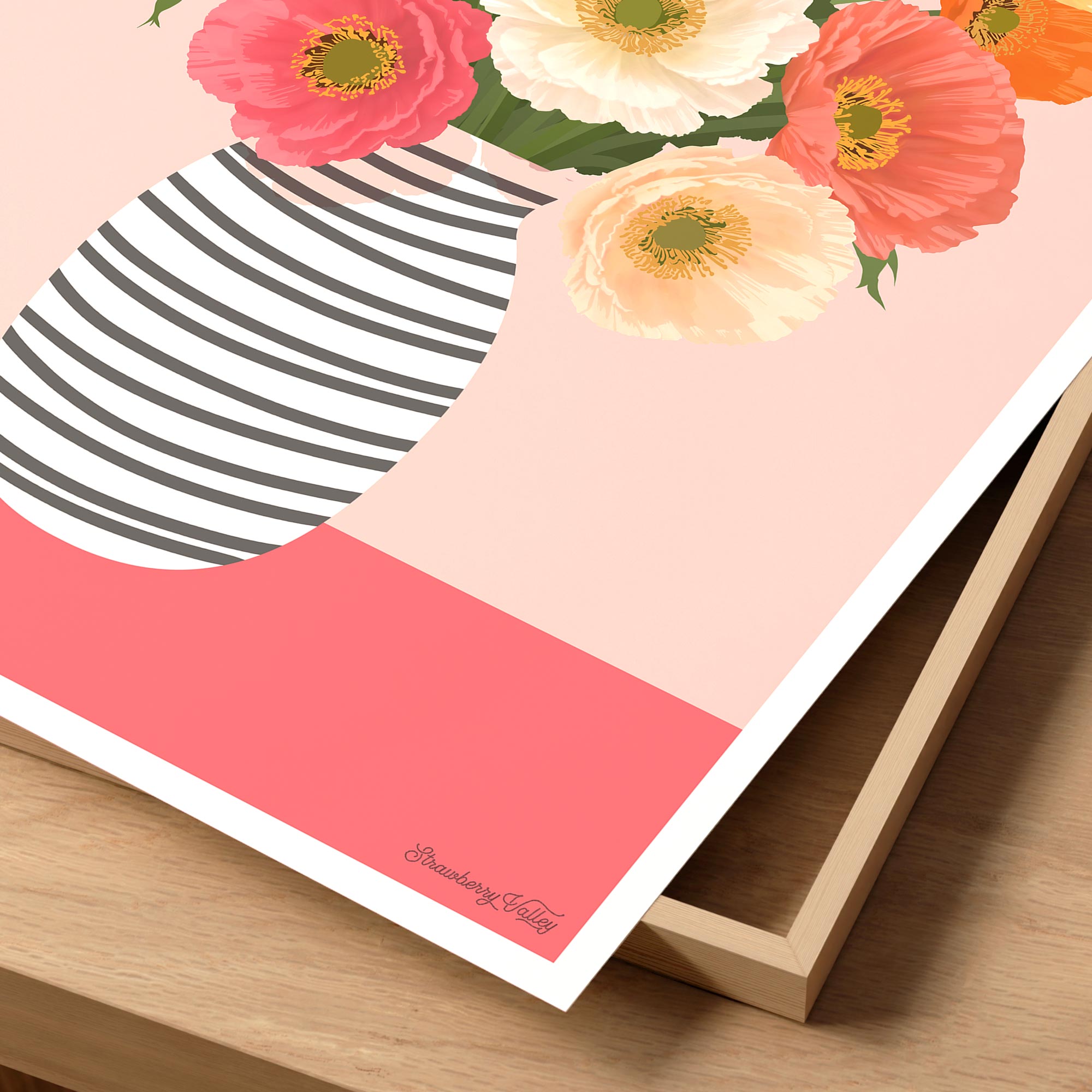 Notebook with floral design and striped pattern on a wooden surface